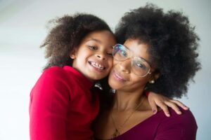 kid smiling with parent